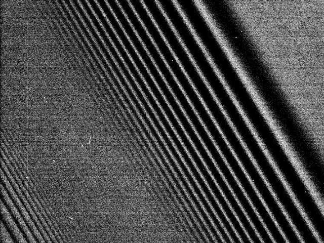 Cassini Images Density Waves in Saturn's Rings