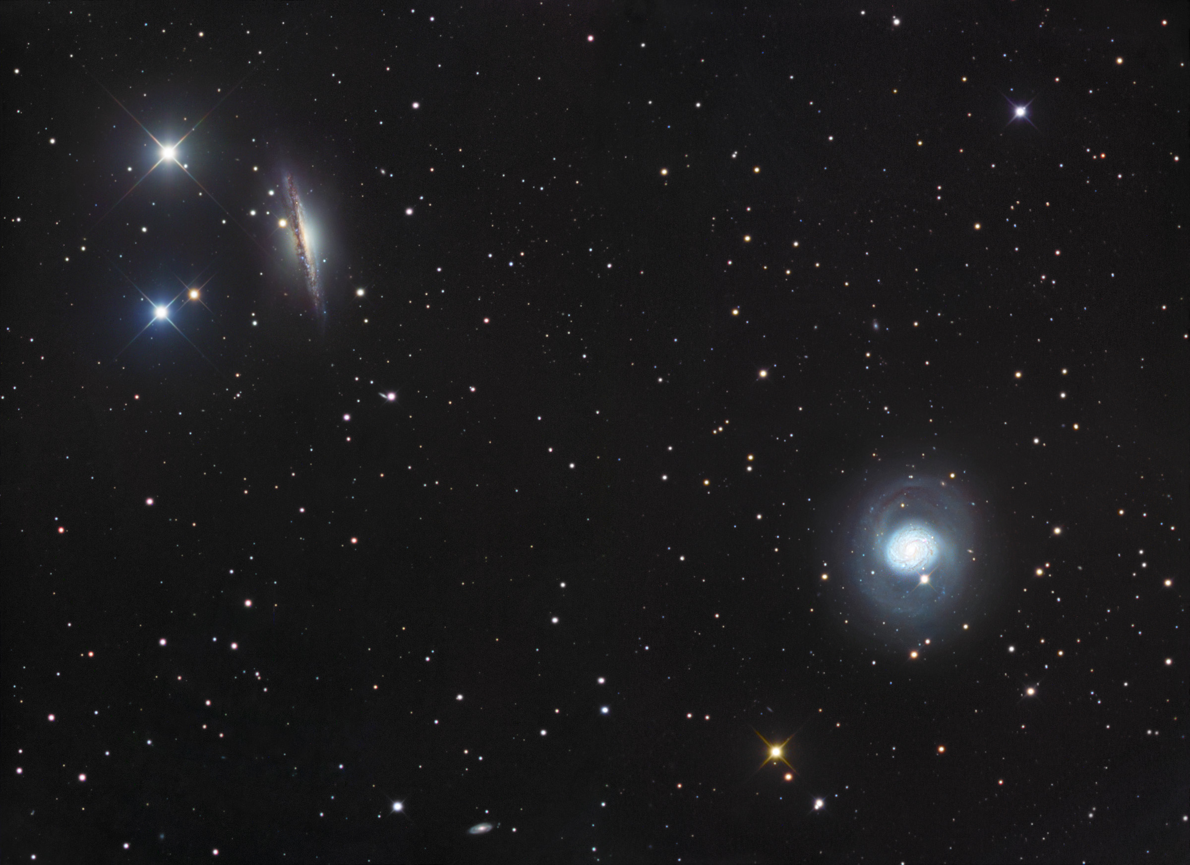 NGC 1055 and M77
