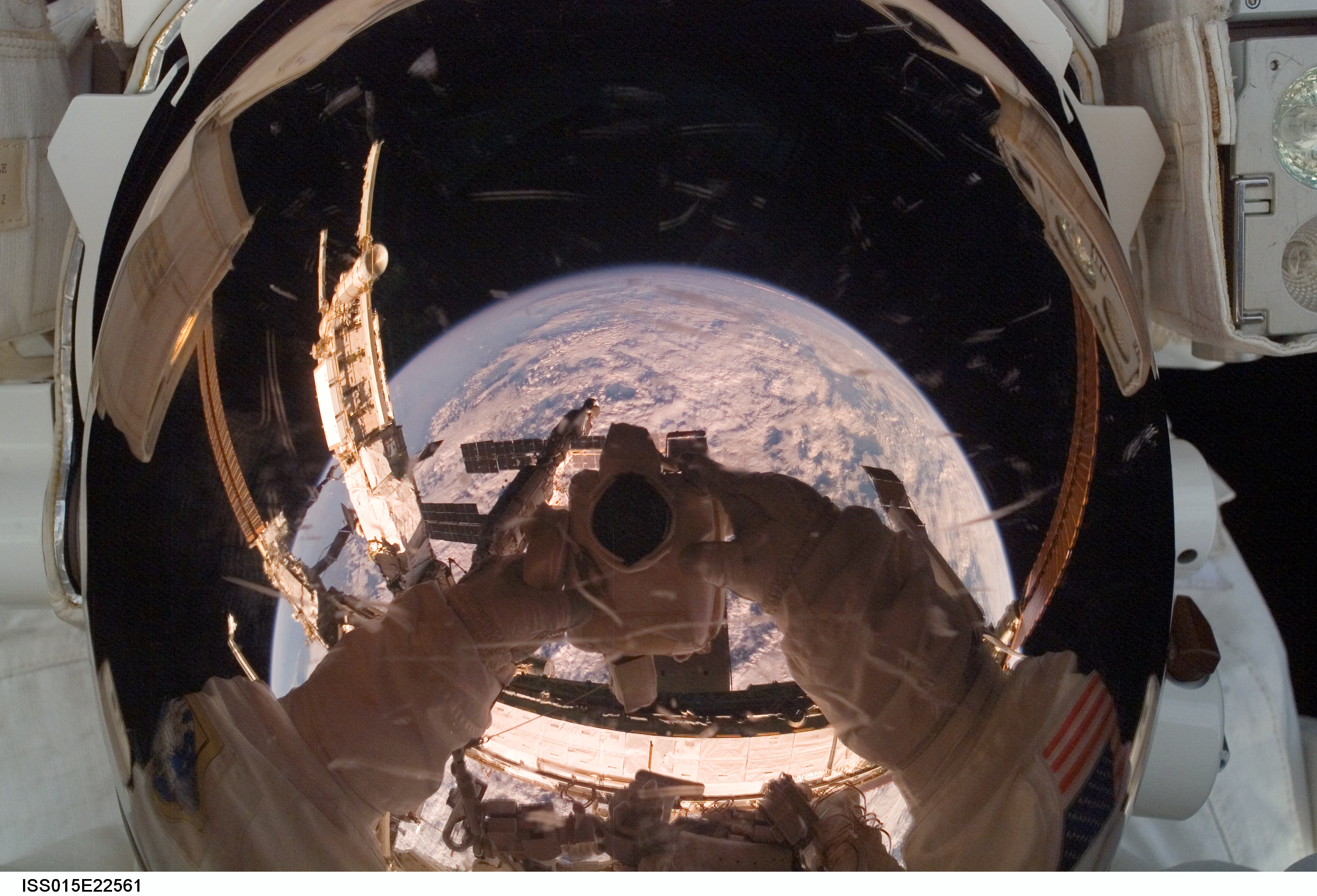 Orbiting Astronaut Reflects Earth