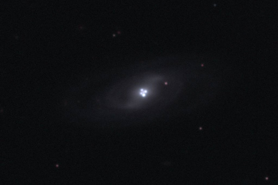 The Einstein Cross Gravitational Lens
