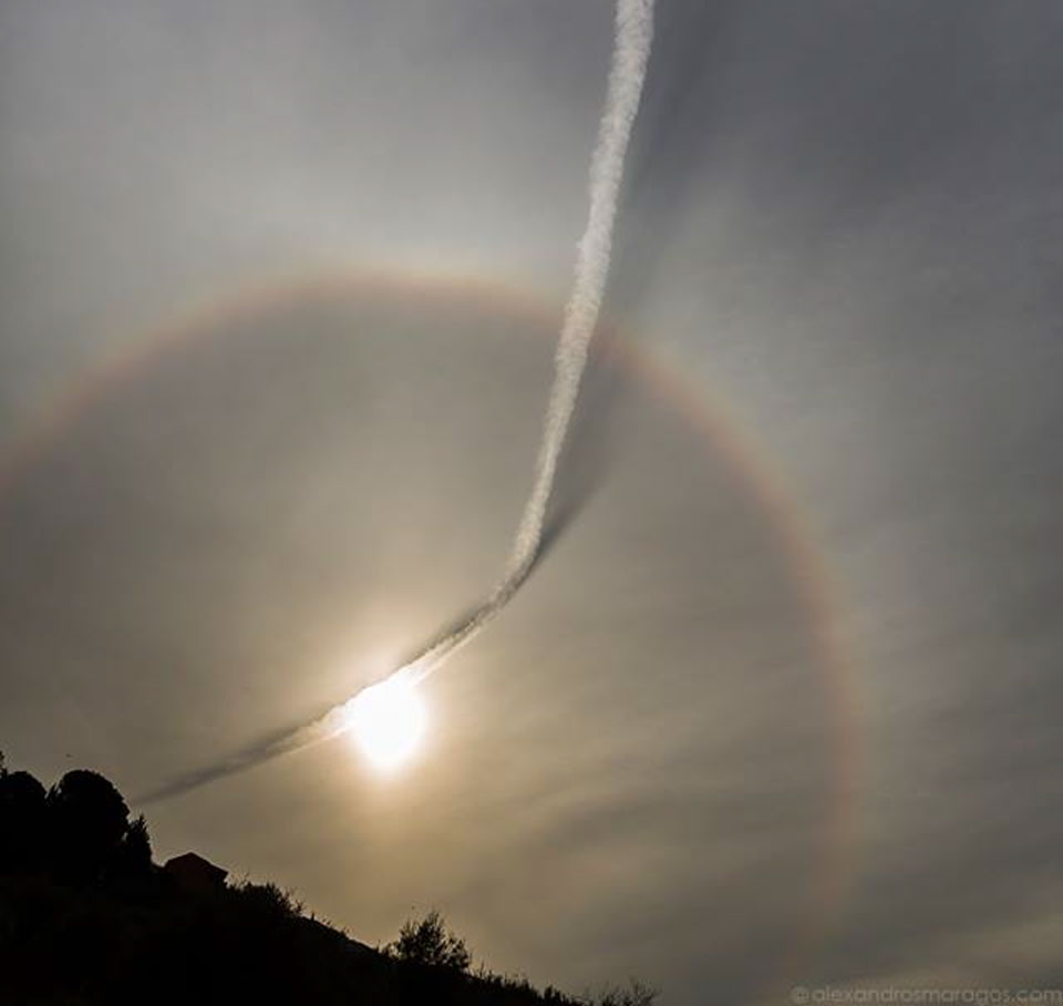 Plane Contrail and Sun Halo