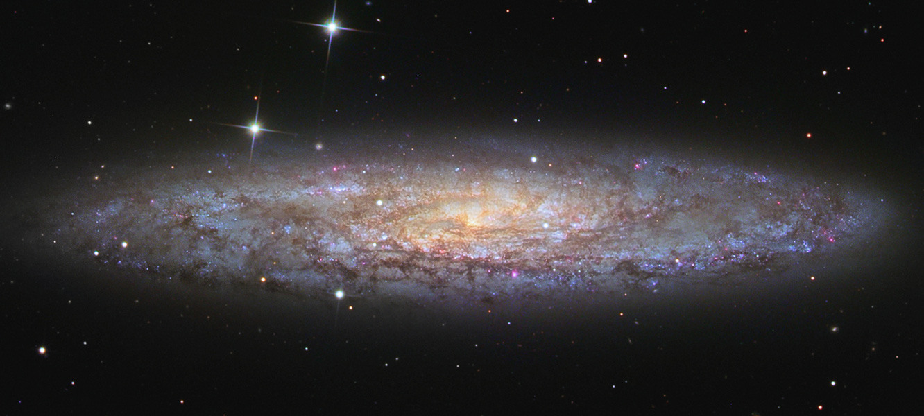 NGC 253: Dusty Island Universe