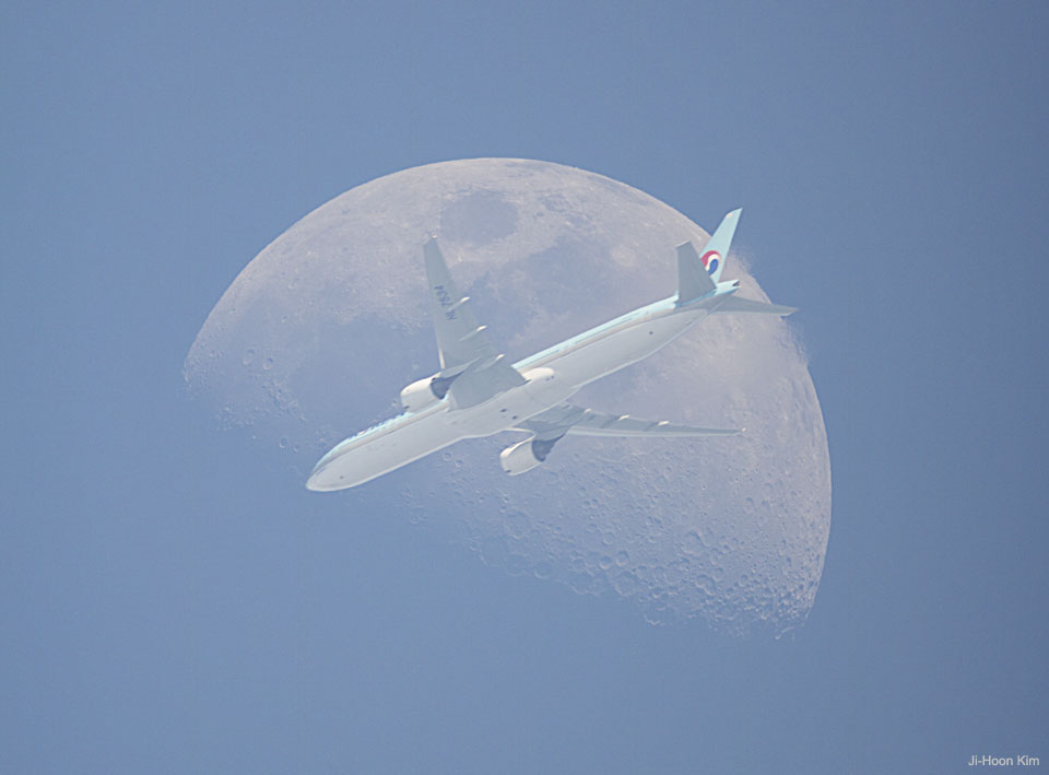 An Airplane in Front of the Moon