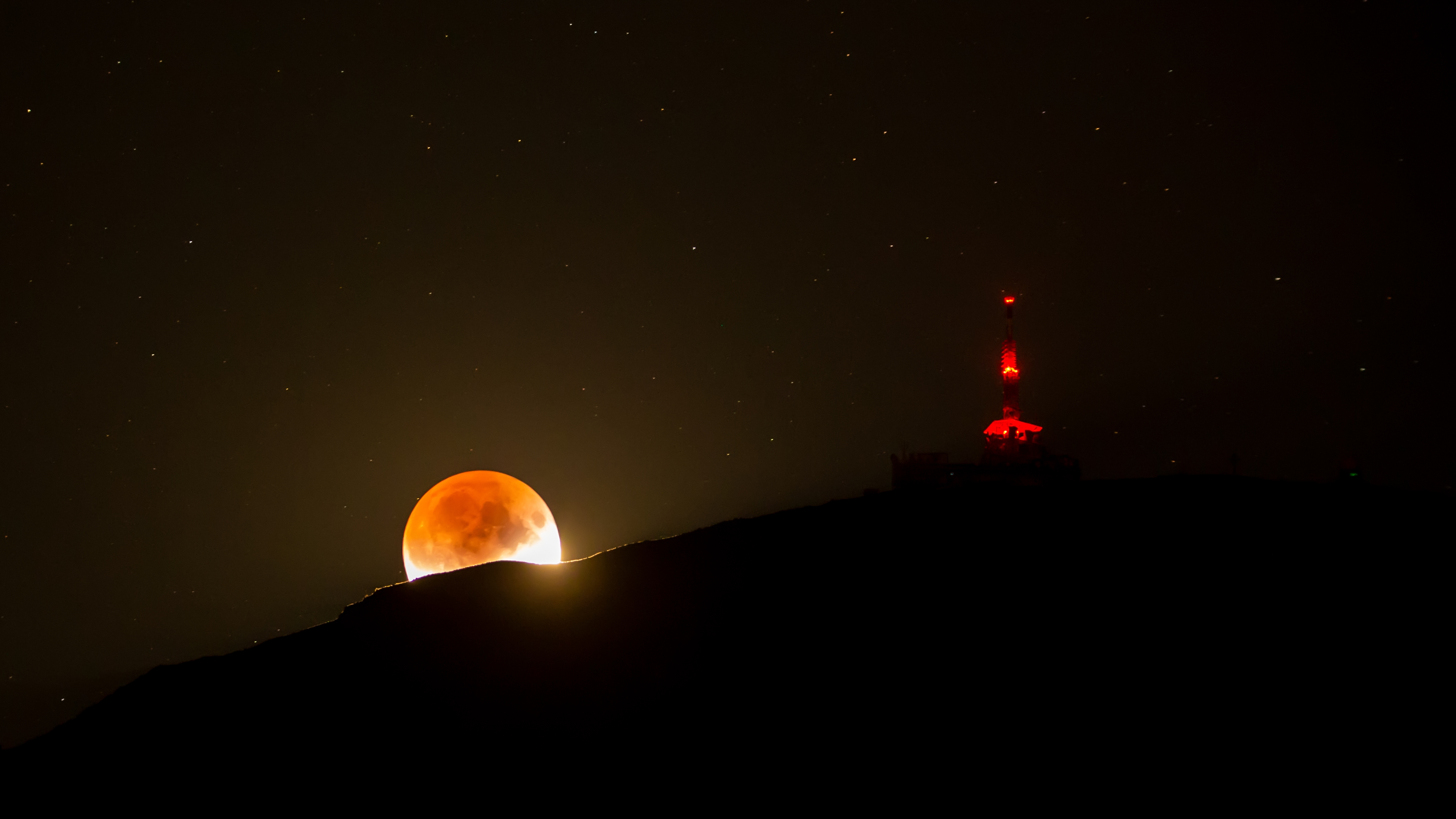 Shadowed Moon and Mountain